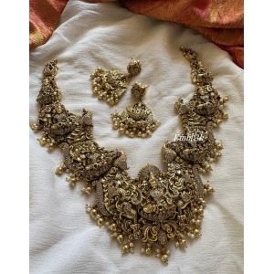 Lakshmi Ad stones intricate work gold replica short neckpiece Lakshmi Ad stones intricate work gold replica short neckpiece